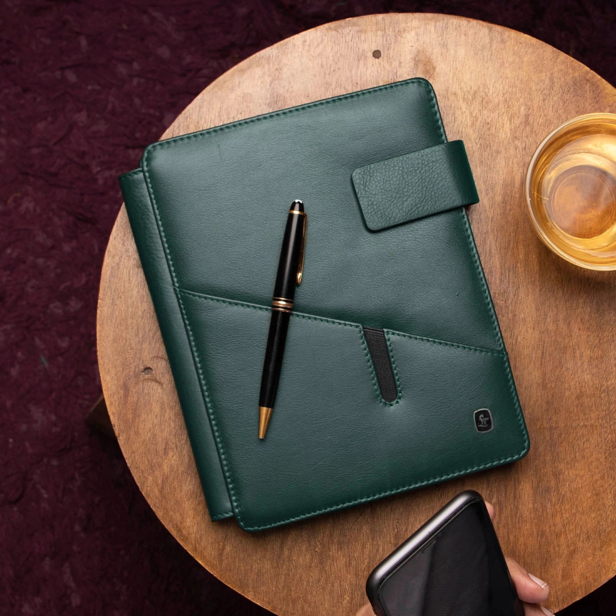 Genuine leather notebook open view showing six card slots, zipper pocket, and pen holder by Leather Talks.
