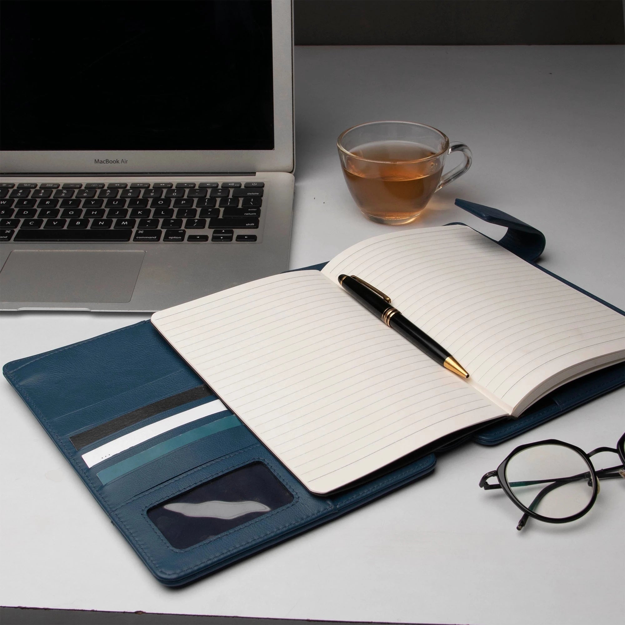 Notebook open view displaying monthly planner layout with objectives section.