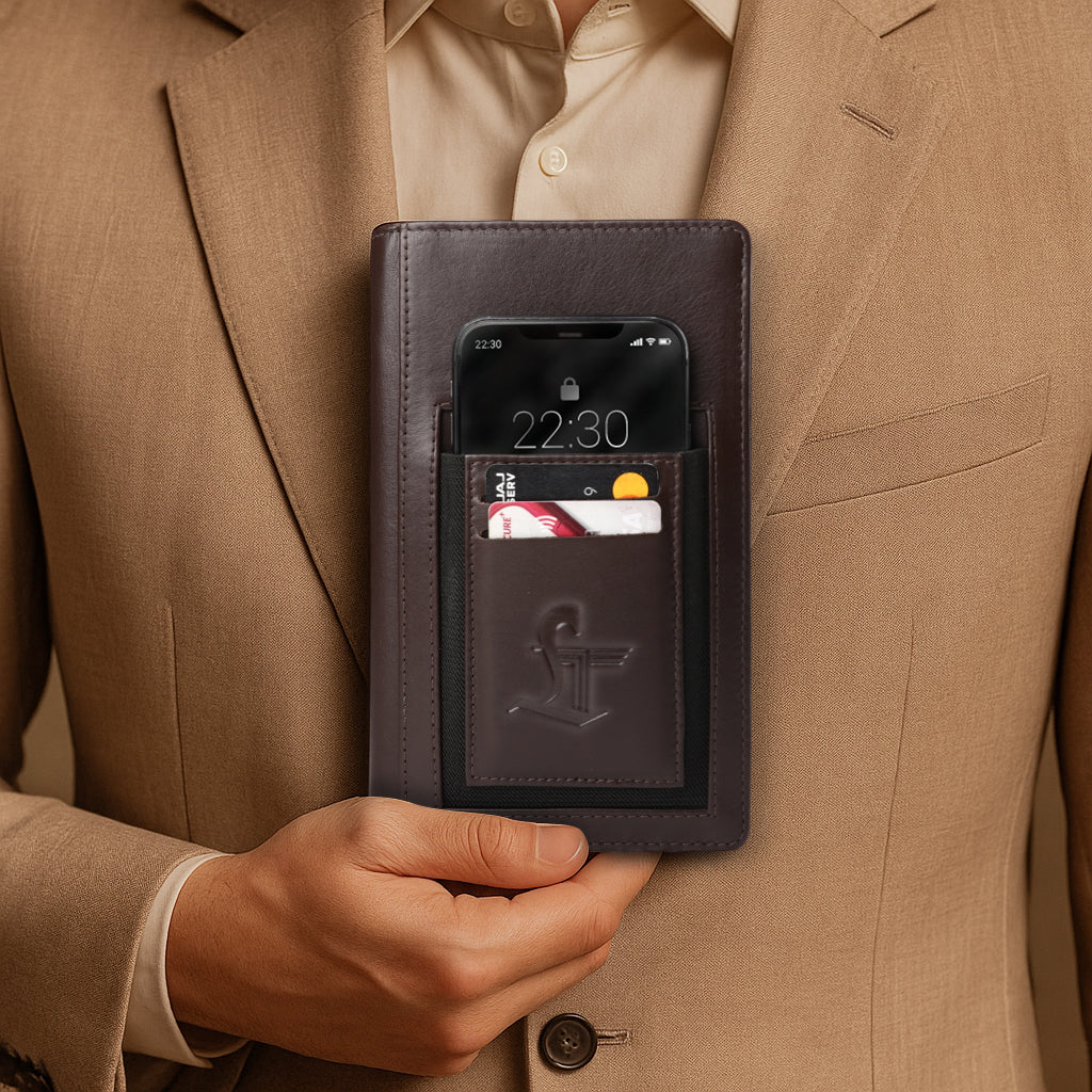 Person holding a dark leather phone case with card slots, displaying a phone screen.