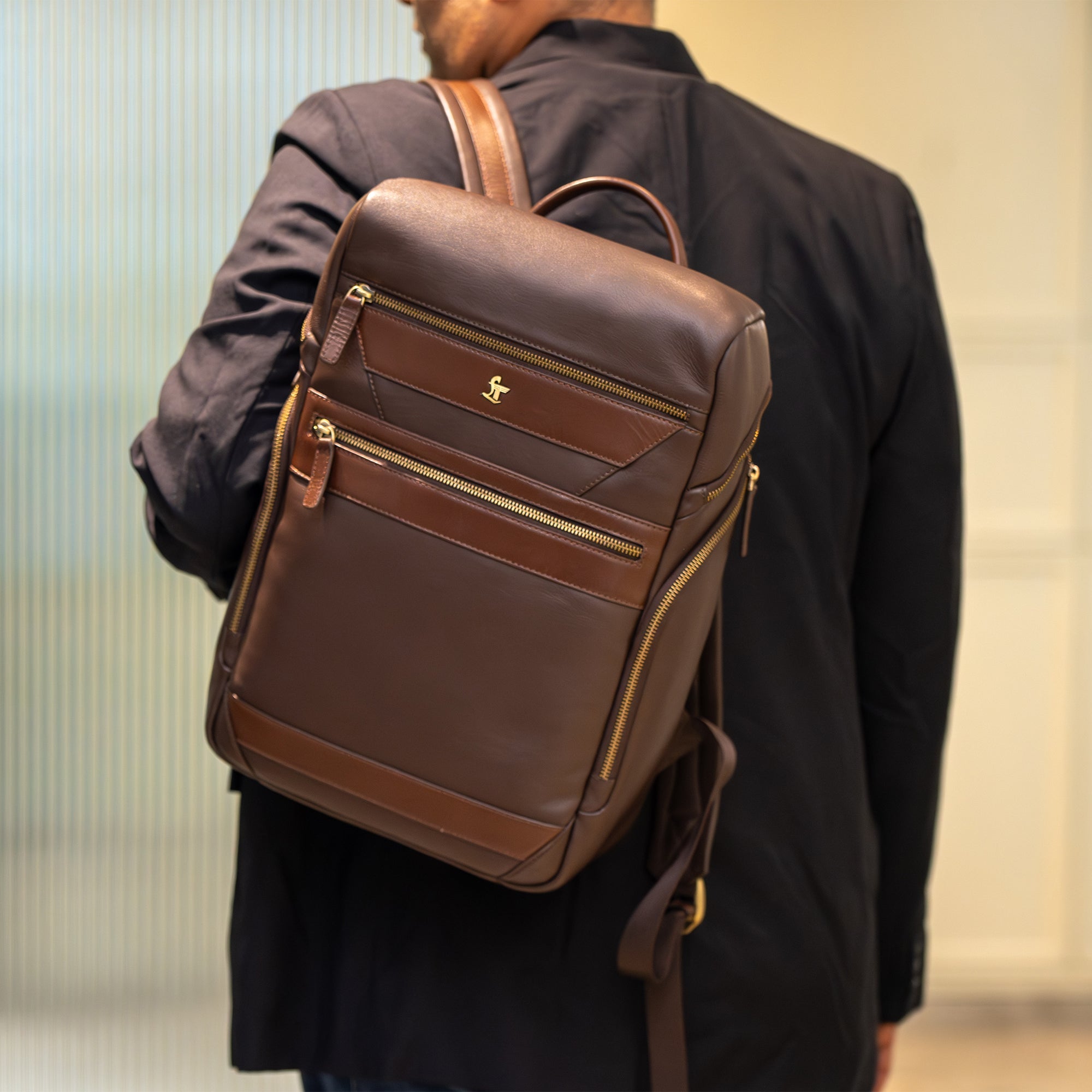Premium genuine leather backpack for men with modern design and features.